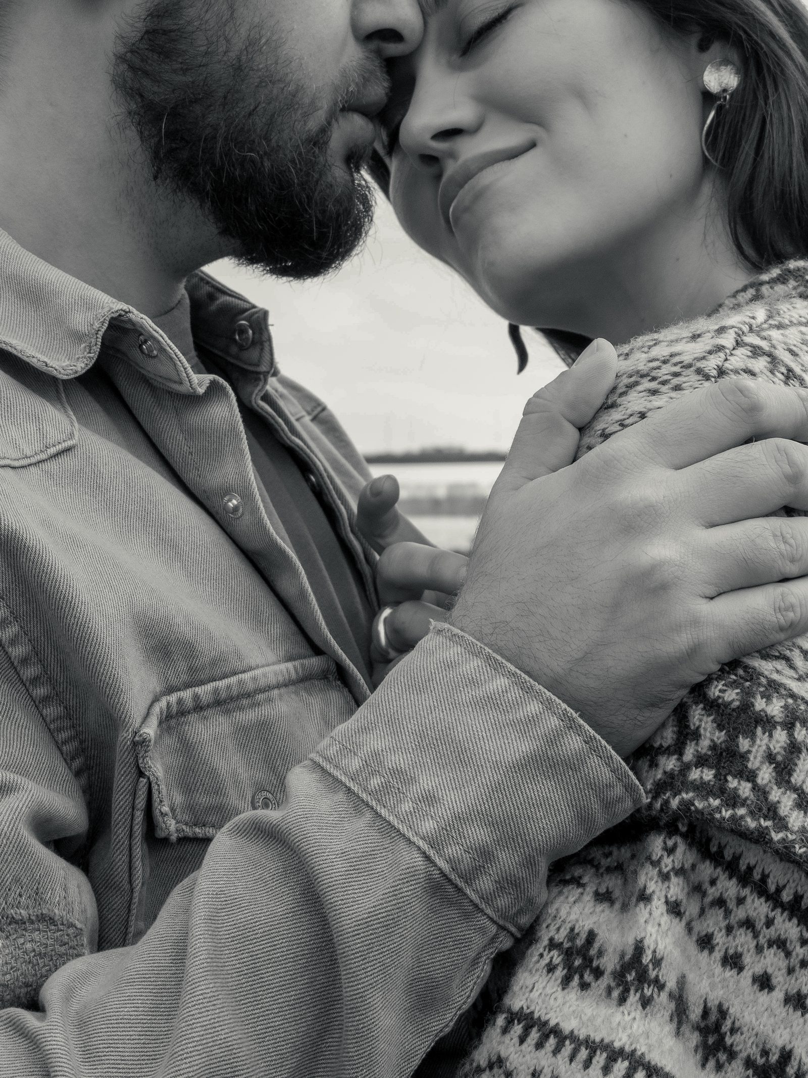 Love couple embrace black and white close up
