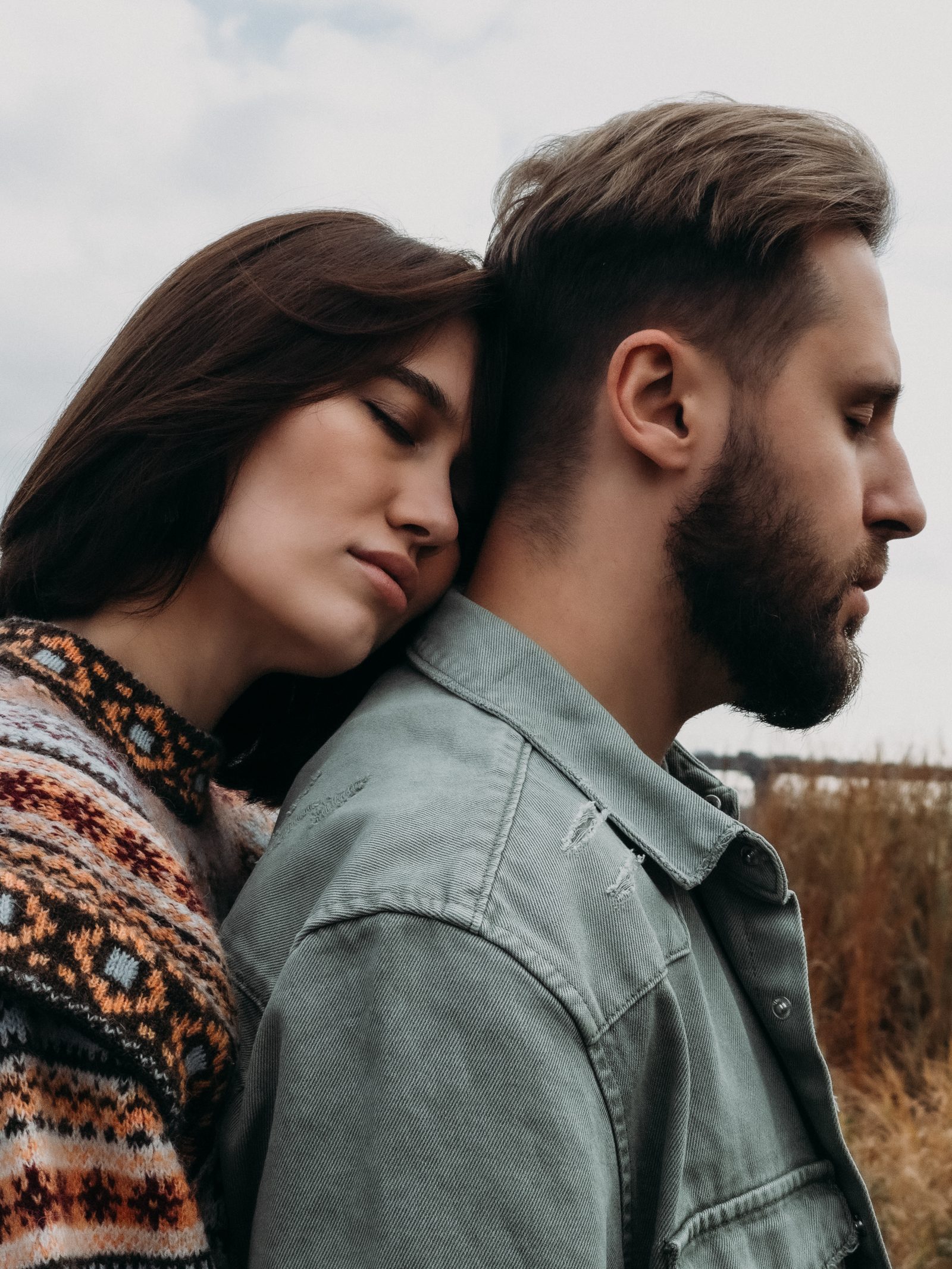 Love couple side profile forehead touch riverside