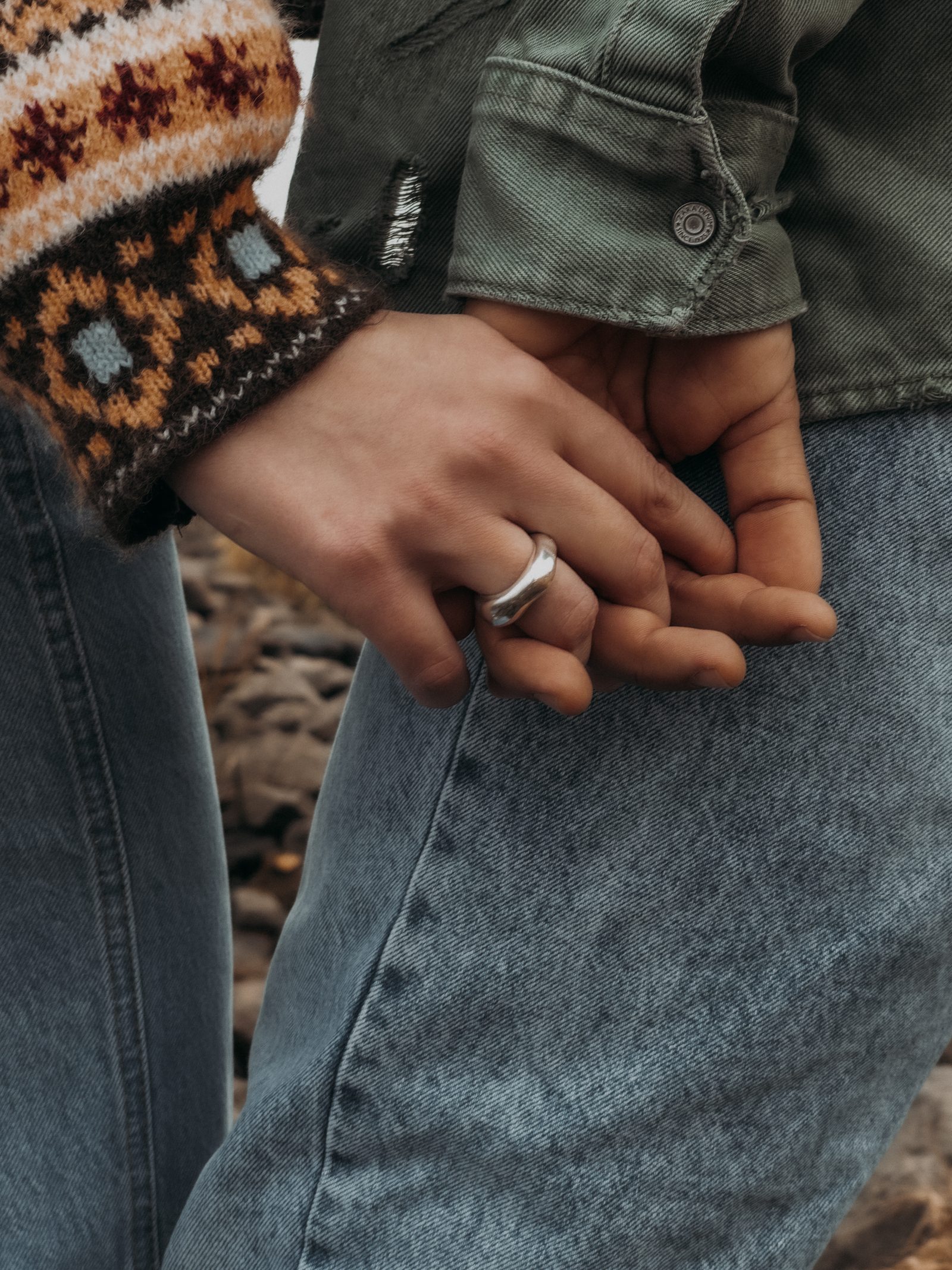 Love couple holding hands ring detail close up