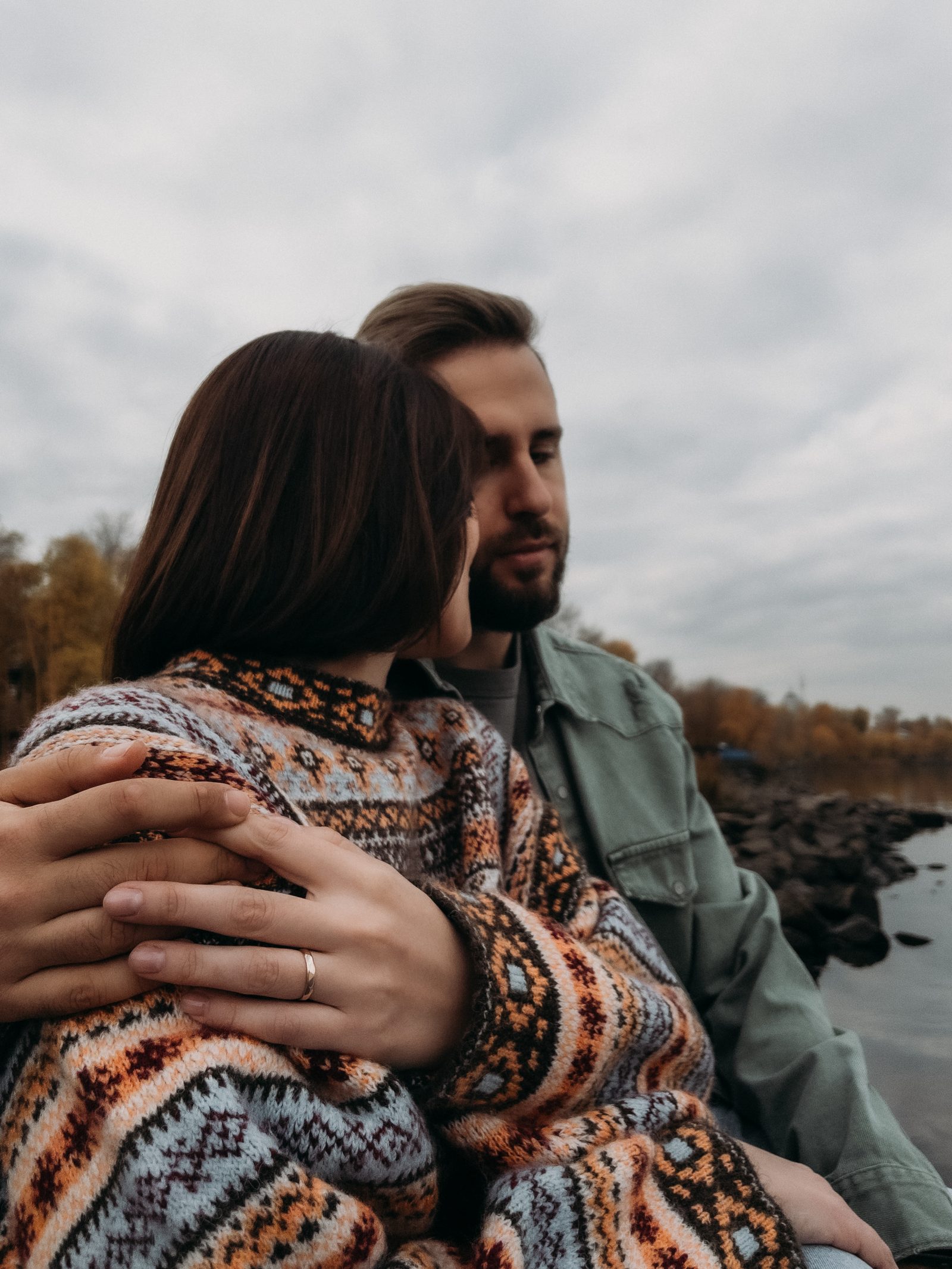 Love couple hug close up riverside portrait