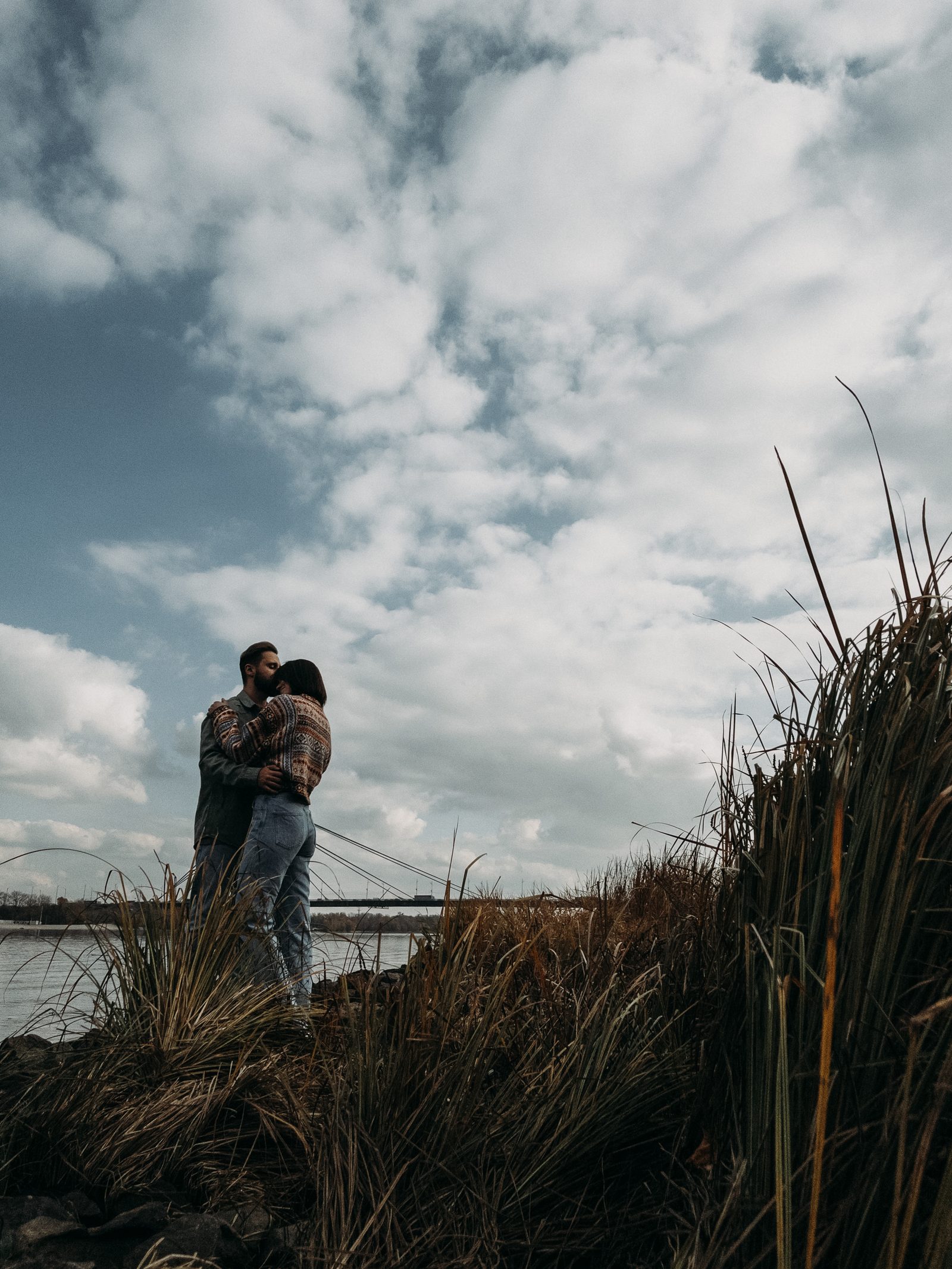 Love couple embrace riverside bridge kyiv