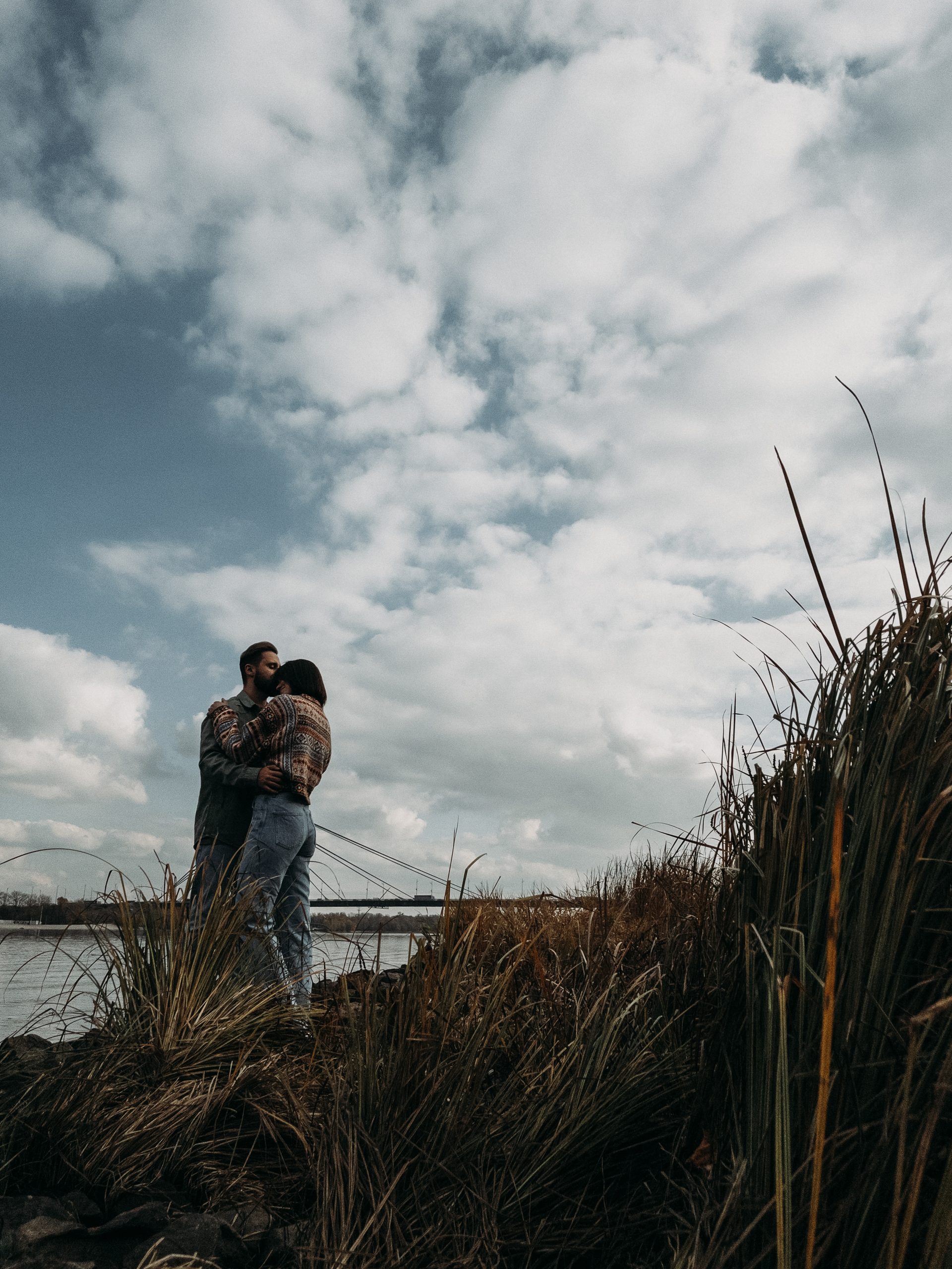 Love couple embrace riverside bridge kyiv