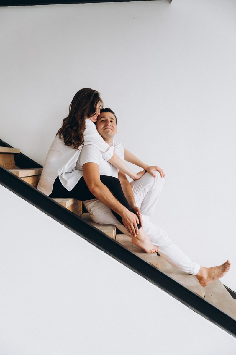 Love couple embrace staircase portrait