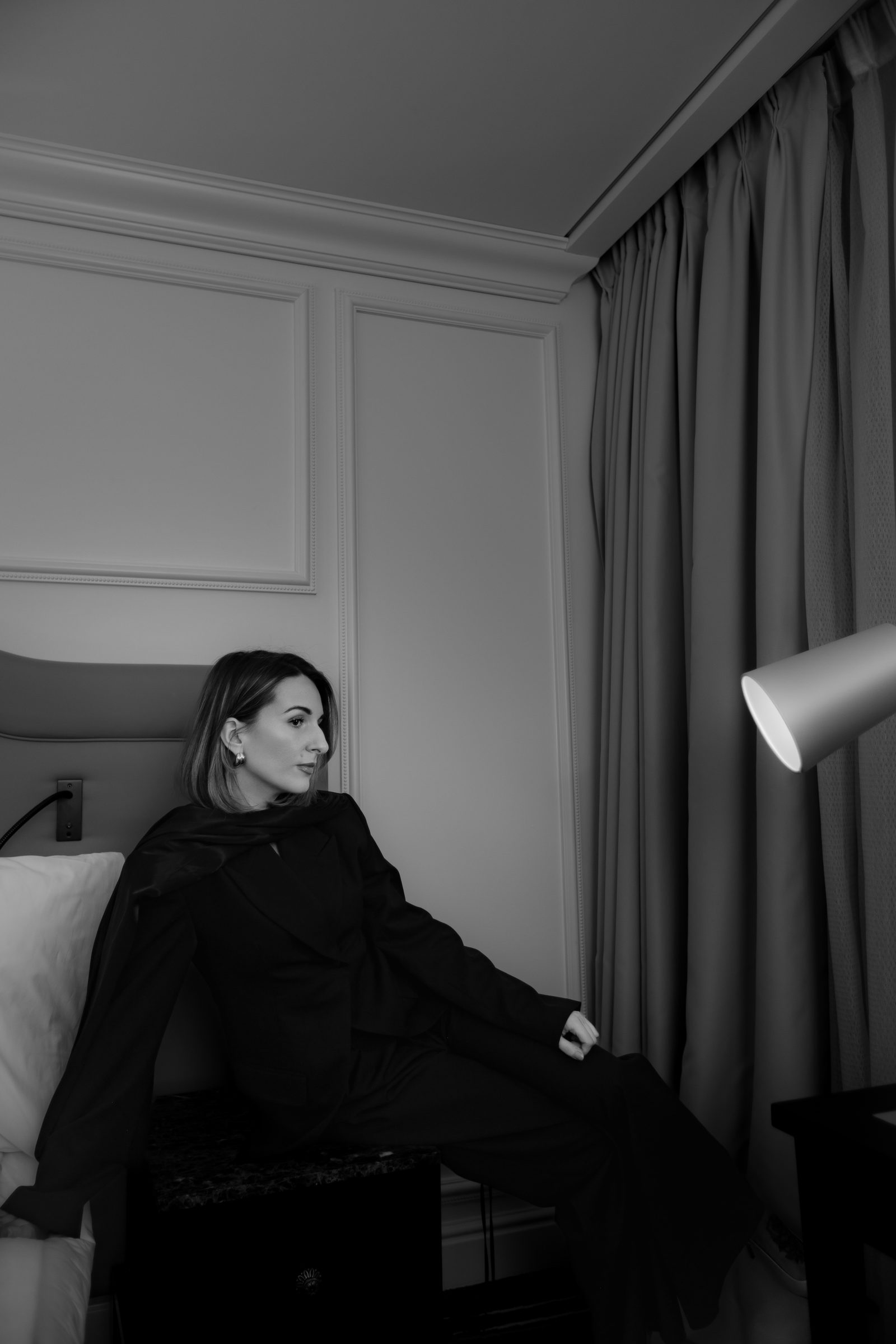 Sara black and white bedroom recline portrait
