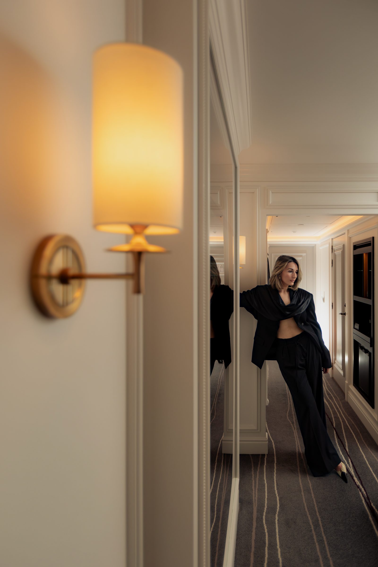 Sara hallway mirror lean black blazer editorial