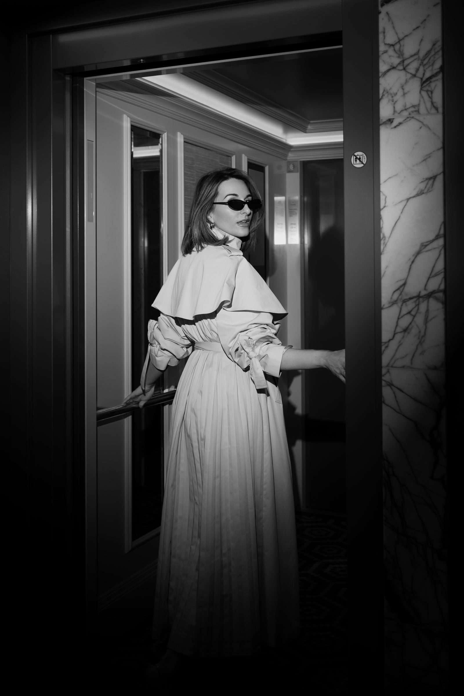Sara cream trench elevator black and white profile