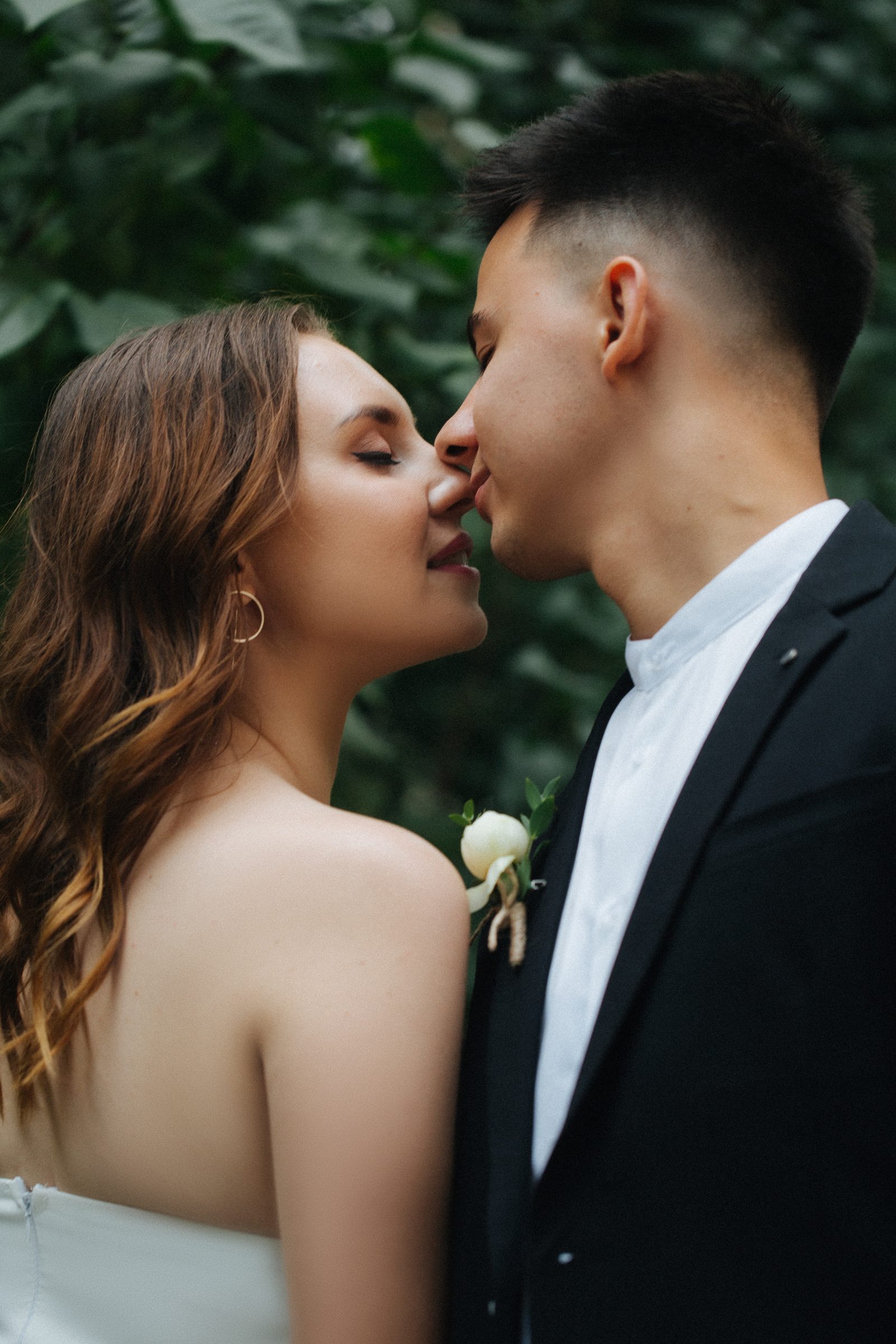 Wedding bride groom nose to nose romantic moment