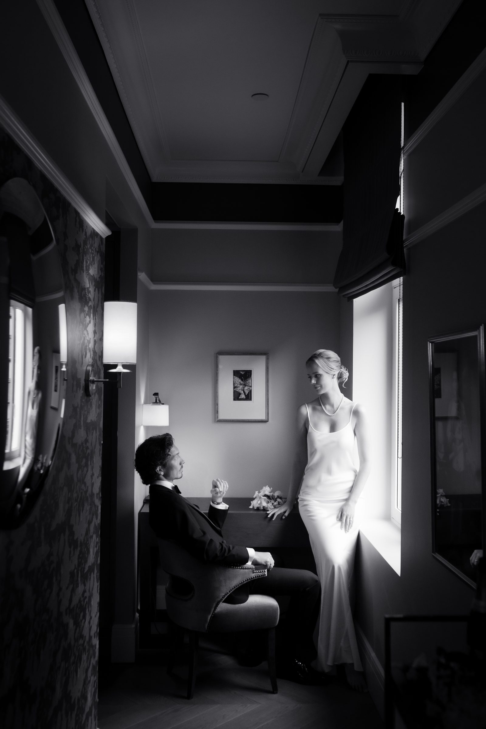 Wedding couple hallway window portrait bw