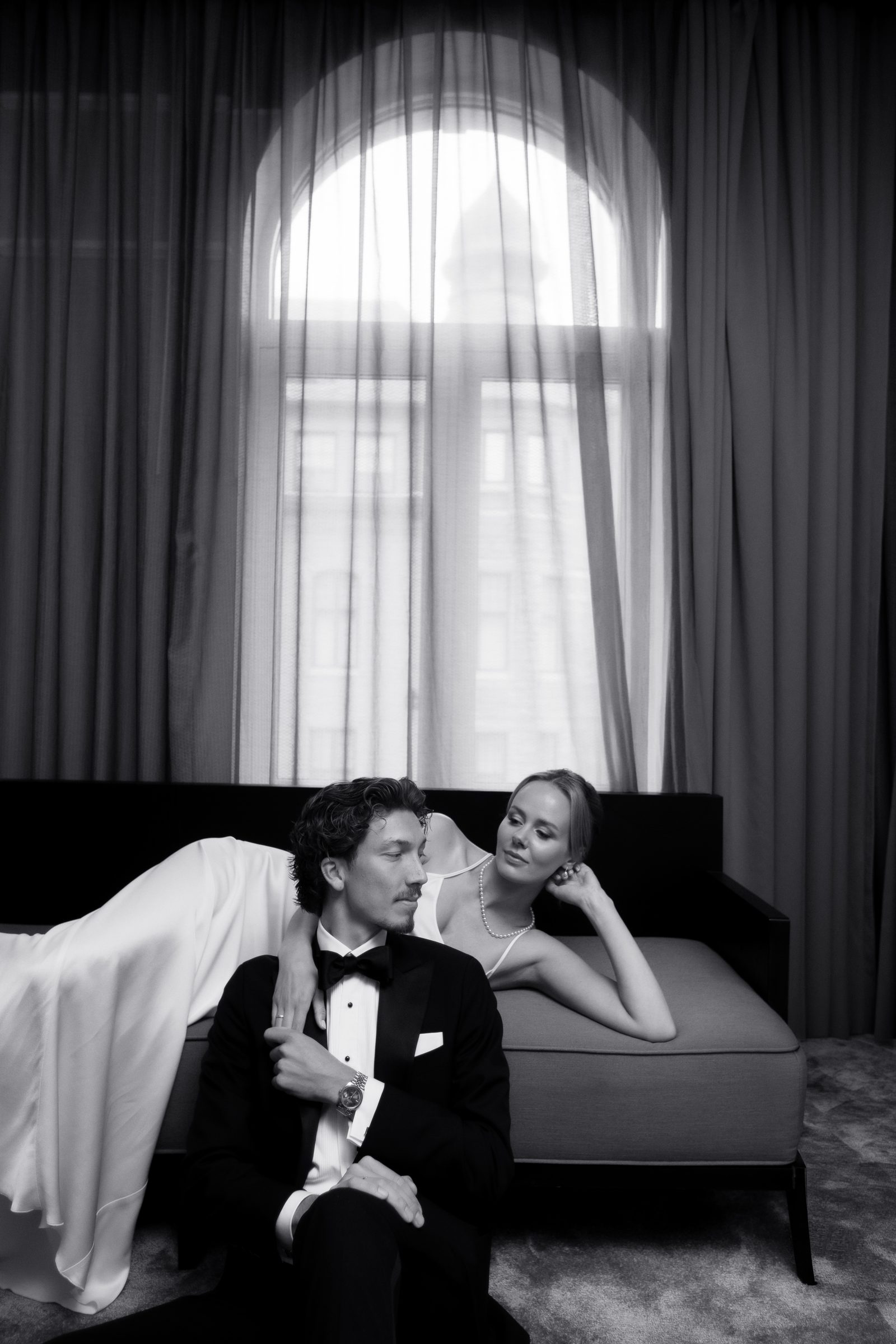 Wedding couple lounge chaise portrait bw
