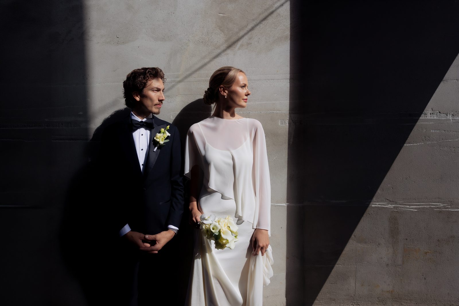 Wedding couple portrait light shadow concrete wall